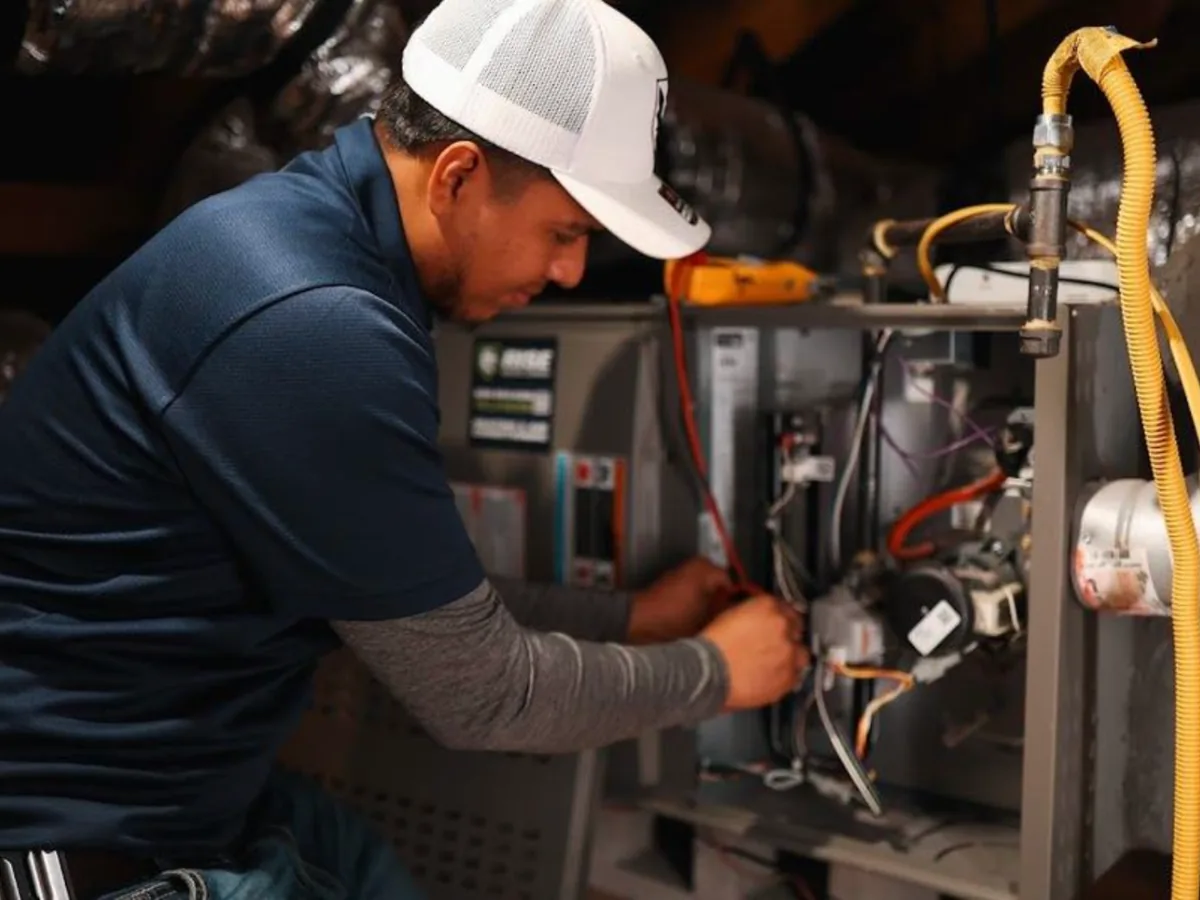Rise Service Company technician repairing a furnace